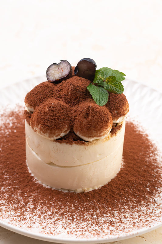 Close-up of a cocoa-dusted tiramisu dessert, the coffee-and-mascarpone flavor behind fall 2026's tiramisu spread trend