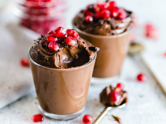 Layered chocolate no-bake dessert cups in glasses — the base for easy no-bake Halloween desserts