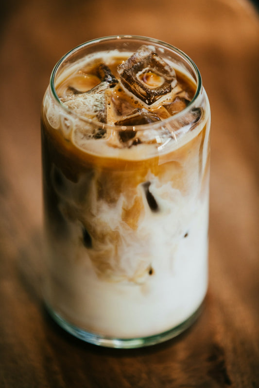 Iced Dubai chocolate coffee pistachio latte in a clear glass