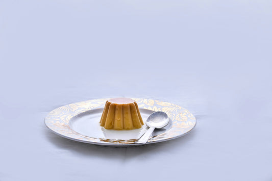 A spoonful of glossy caramel cookie butter spread in a dish, styled for fall dessert recipes